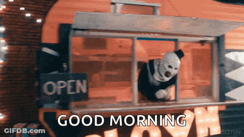 Clown Looking Out Window Saying Good Morning GIF