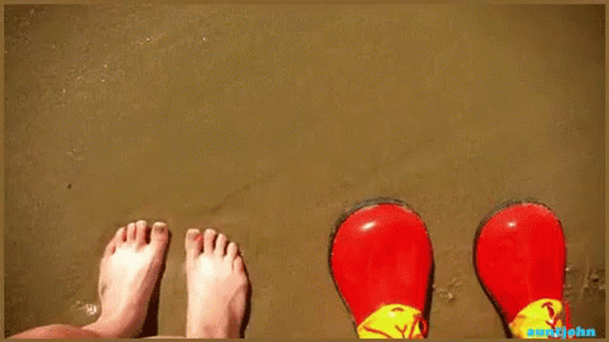 Clown Shoes Beside Barefoot GIF