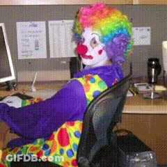 Clown Sitting At Desk With Computer GIF