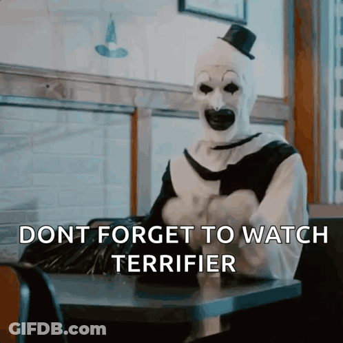 Clown Sitting At Table Dont Forget To Watch Terrifier GIF