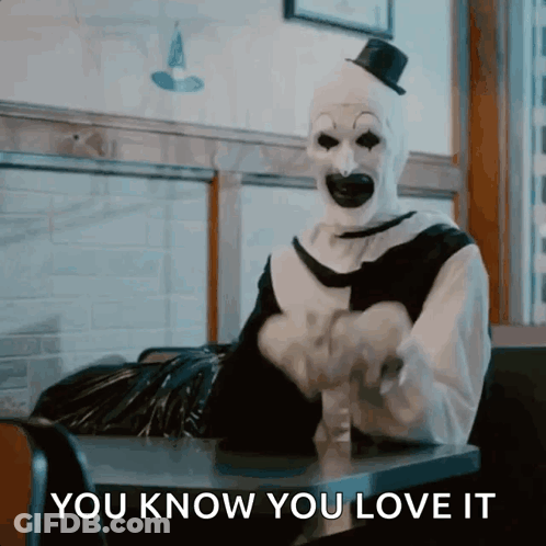 Clown Sitting At Table Saying You Know You Love It GIF