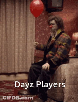 Clown Sitting On Bed Holding Red Balloon GIF
