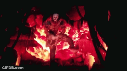 Clown Standing In Burning Building GIF