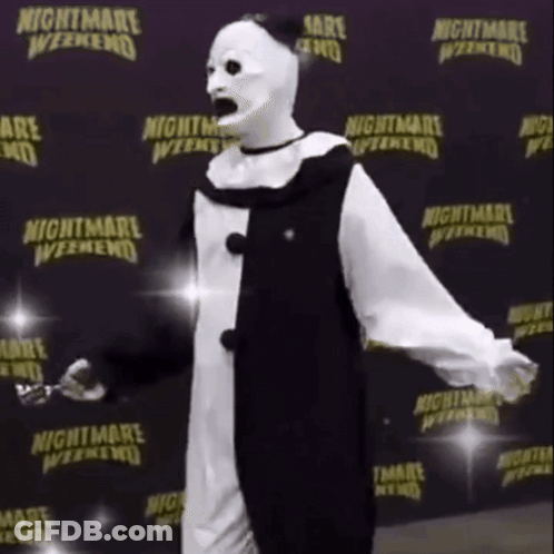 Clown Standing In Front Of Nightmare Weekend Sign GIF