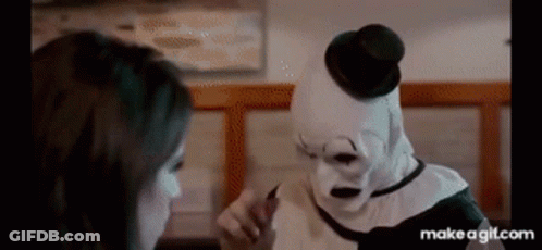 Clown Talking To Woman In Diner GIF