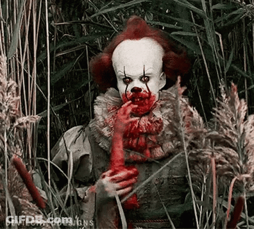 Clown With Blood Holding Bloody Hand GIF