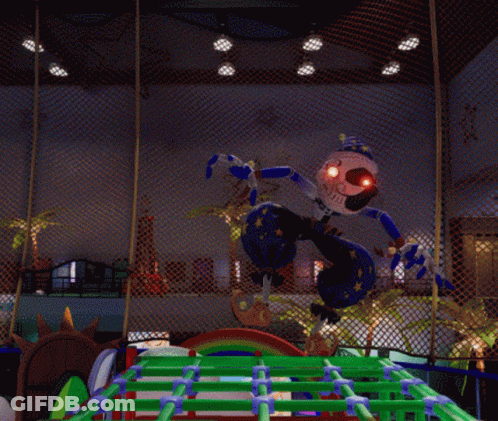 Clown With Red Eyes Standing In Fenced Area GIF