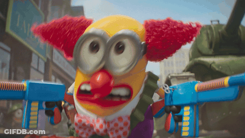 Clown With Red Hair And Bow Tie Holding Toy Guns GIF
