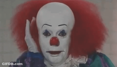 Clown With Red Hair And Red Nose Making Funny Face GIF