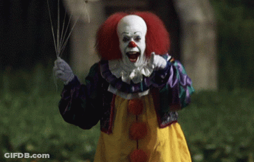 Clown With Red Hair Holding Balloon GIF