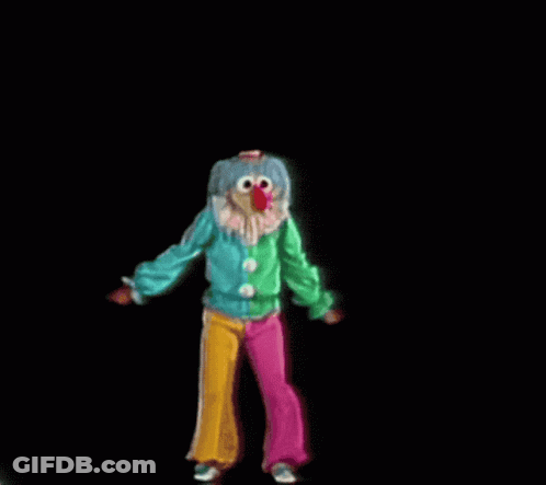 Clown With Red Nose In Green Jacket And Pink Pants GIF