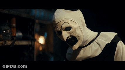 Clown With White Mask Looking At Camera GIF