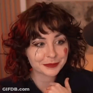 Clown Woman With Curly Hair And Red Lipstick GIF