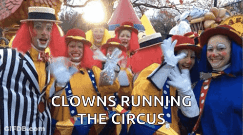 Clowns Posing With Caption Clowns Running The Circus GIF