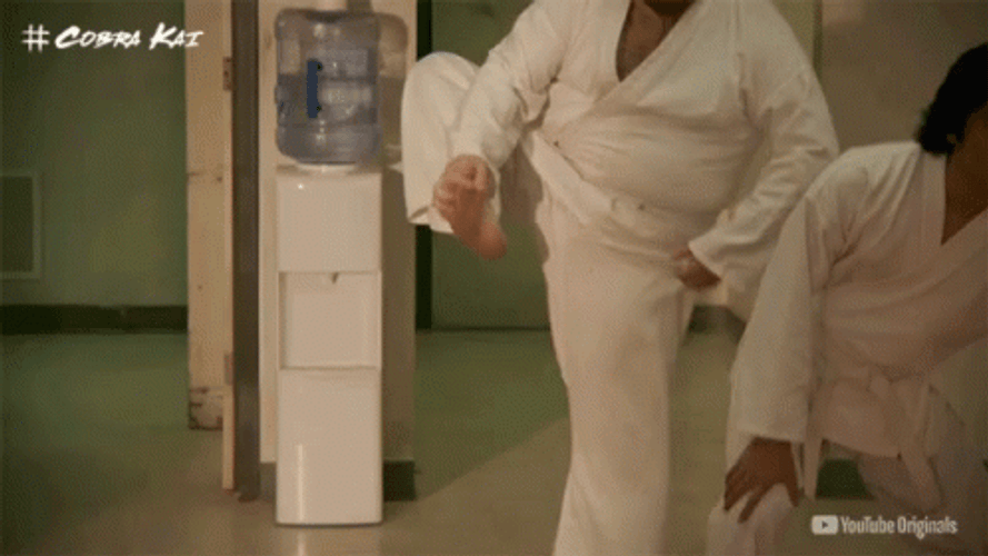 Cobra Kai Raymond Leg Stretch GIF