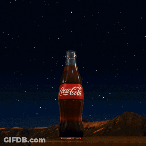 Coca-Cola Bottle Under Starry Night Sky GIF