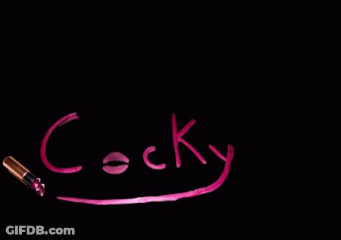 Cocky Written In Pink On Black Surface GIF