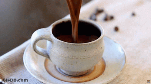 Coffee Being Poured Into Cup On Saucer GIF
