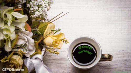 Coffee Cup Beside Flowers Saying Good Morning GIF