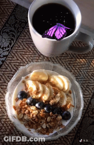 Coffee Cup Next To Bowl Of Granola GIF