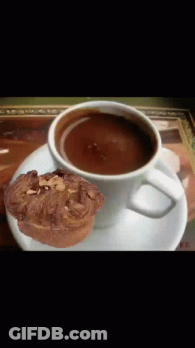 Coffee Cup With Croissant On Saucer GIF