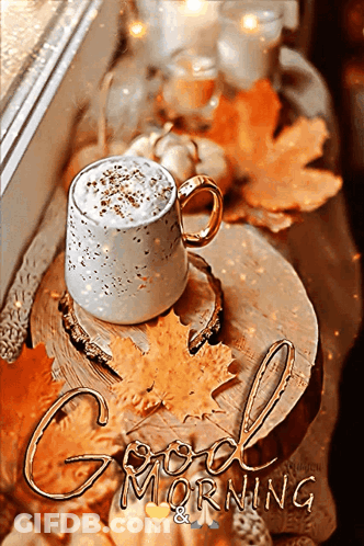 Coffee On Wooden Table With Autumn Leaves And Candles GIF