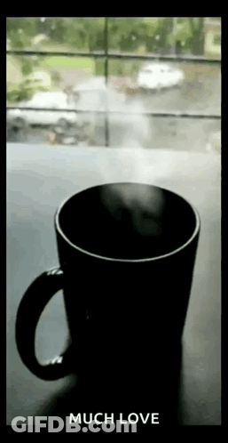 Coffee With Steam Next To Window GIF