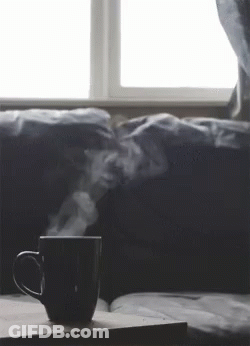 Coffee With Steam On Table By Window GIF