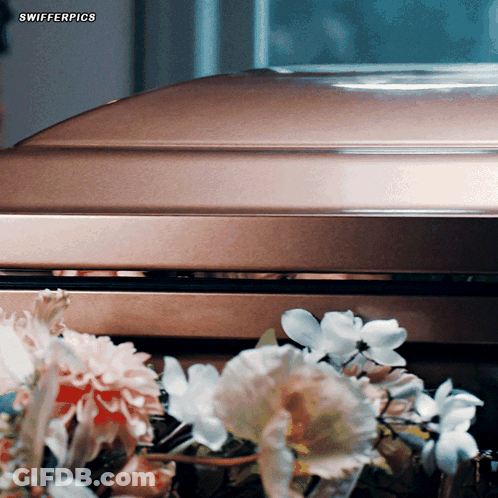 Coffin With Flowers Saying Swifterpics GIF