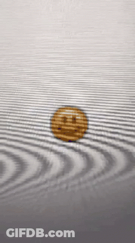 Coin With Smiley Face Floating In Water GIF