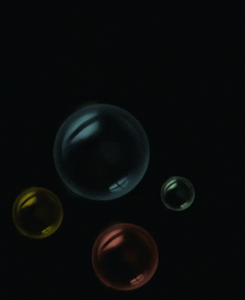 Colorful Bubbles In Dark GIF