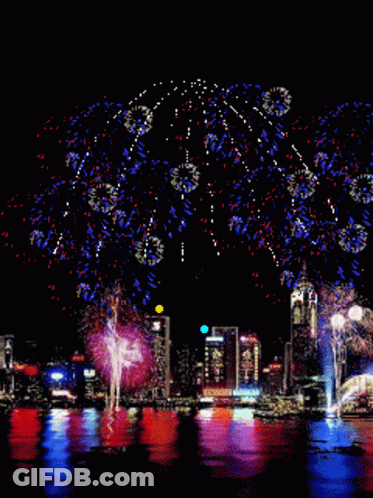 Colorful Fireworks Over City GIF