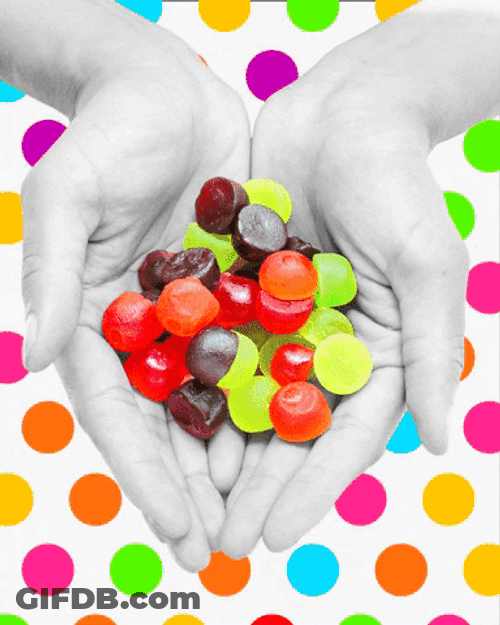 Colorful Gummies On Palm GIF