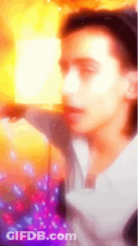 Colorful Man Holding Book GIF