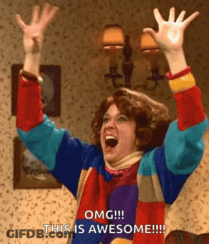 Colorful Sweater Woman Raising Arms Omg This Is Awesome GIF