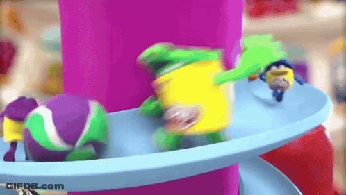 Colorful Toys On Blue And Purple Carousel GIF