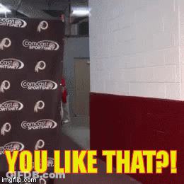 Comcast Sportsnet Sign Behind A Wall GIF