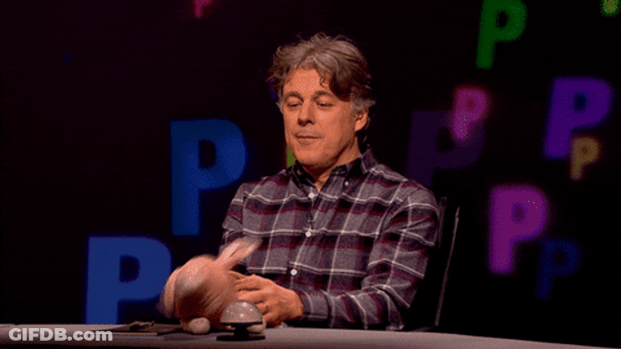 Comedian Alan Davies Making Toy Pig Fly GIF