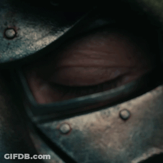 Comic Book Character With Green Cape Looking At Mirror GIF
