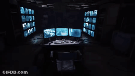 Computer Desk Three Monitors Keyboard Mouse Game Controller GIF