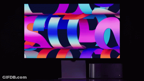 Computer Monitor Displaying Colorful Image With Letter S GIF