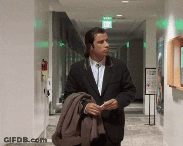 Confused Actor John Travolta In The Hallway GIF