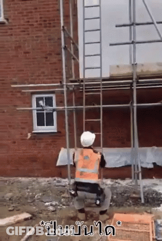 Construction Worker Kneeling In Orange Vest And Hard Hat GIF