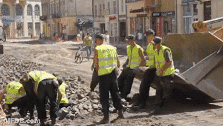 Construction Workers Tossing Rocks GIF