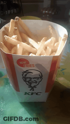 Container Of KFC French Fries On Green Table GIF