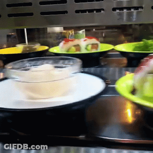 Conveyor Belt With Plates Of Food And Bowl Of Soup GIF