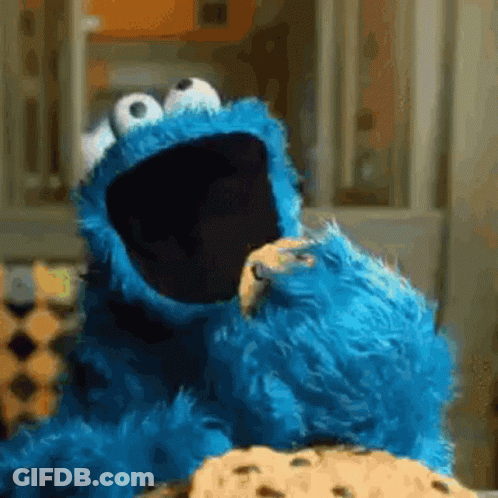 Cookie Monster Eating A Cookie With His Mouth Open GIF