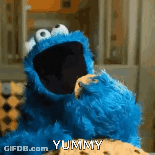 Cookie Monster Eating Cookie Saying Yummy GIF