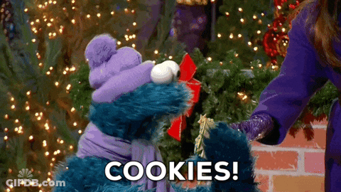 Cookie Monster From Sesame Street Is Giving A Gift To A Woman GIF
