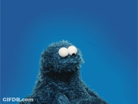 Cookie Monster Holding A Red Heart In Front Of His Face GIF